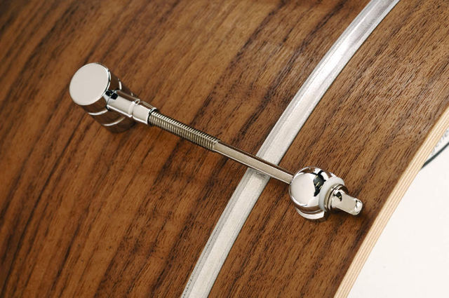 blank Tension bolts pass through each ear and into the lugs.